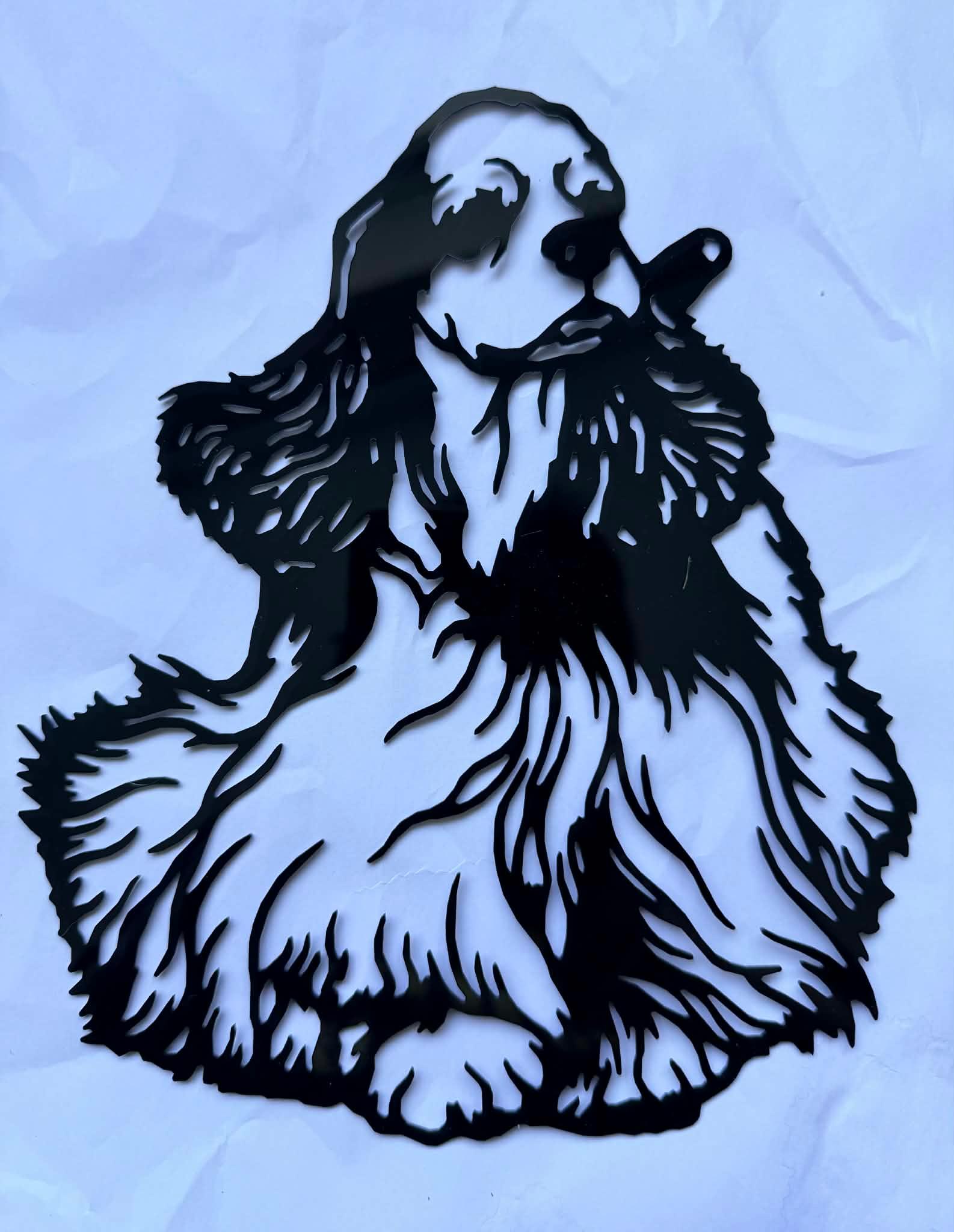 Finished black acrylic laser cut of the same cocker spaniel